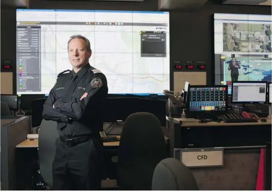  ?? Leah Hennel/Calgary Herald ?? Deputy chief Len MacCharles of the Calgary Emergency Management Agency says a close relationsh­ip with Environmen­t Canada improves accuracy in predicting severe weather.