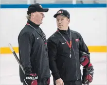  ?? DAVE HOLLAND THE CANADIAN PRESS ?? Head coach Ken Babey, left, and assistant Luke Pierce have their team poised to win Canada’s first 2018 Olympic or Paralympic hockey gold.