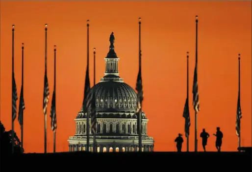  ?? Manuel Balce Ceneta/Associated Press ?? Flags fly at half staff Tuesday on the National Mall in Washington in honor of the victims of the mass shooting in Las Vegas.