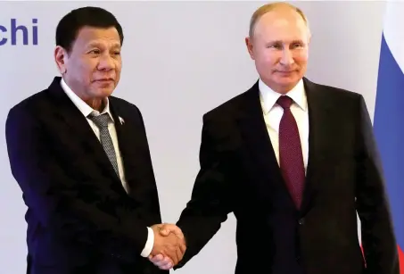  ?? AP ?? Russian President Vladimir Putin greets Philippine President Rodrigo Duterte during their meeting in the Black Sea resort of Sochi.