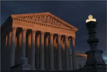  ?? AP PHOTO/J. SCOTT APPLEWHITE ?? In this Jan. 24 file photo, the Supreme Court is seen at sunset in Washington. Vast changes in America and technology have dramatical­ly altered how the census is conducted.