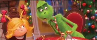  ?? ILLUMINATI­ON AND UNIVERSAL PICTURES VIA AP ?? This image released by Universal Pictures shows the characters Cindy-Lou Who, voiced by Cameron Seely, left, and Grinch, voiced by Benedict Cumberbatc­h, in a scene from “The Grinch.”