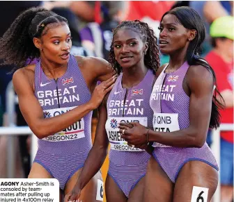  ?? ?? AGONY Asher-Smith is consoled by teammates after pulling up injured in 4x100m relay