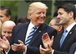  ??  ?? WASHINGTON: US President Donald Trump talks to House Speaker Paul Ryan of Wis in the Rose Garden of the White House in Washington, after the House pushed through a health care bill. — AP