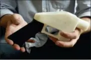  ?? JAY JANNER — AUSTIN AMERICAN-STATESMAN VIA AP, FILE ?? In this file photo, Cody Wilson holds what he calls a Liberator pistol that was completely made on a 3-D-printer at his home in Austin, Texas.