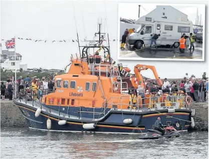  ??  ?? Holyhead RNLI’s annual visit to Cemaes Bay was a big success, as was the car wash day (inset)