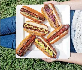  ?? POST] [PHOTO BY JENNIFER CHASE, FOOD STYLING BY LISA CHERKASKY, FOR THE WASHINGTON ?? Charred Carrot Dogs