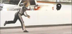  ?? Earl Neikirk / Associated Press ?? Tony Stewart throws his helmet at Matt Kenseth’s car after the two collided during a 2012 race at Bristol Motor Speedway in Bristol, Tenn. The track forever marketed itself as a raging tempest for drivers to lose their cool and explode in aggressive anger.