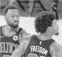  ?? MARK J. TERRILL/AP ?? Kemba Walker, left, Marcus Smart and the Celtics are ready to go.