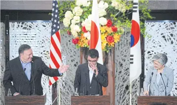  ?? REUTERS ?? US Secretary of State Mike Pompeo, left, Japan’s Foreign Minister Taro Kono, centre, and South Korean Foreign Minister Kang Kyung-wha, right, talk to the press in Tokyo.