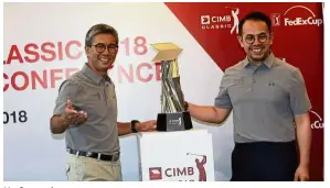  ??  ?? Up for grabs: Deputy Youth and Sports Minister Steven Sim Chee Keong (right) and CIMB Group CEO Tengku Datuk Sri Zafrul Aziz posing with the CIMB Classic trophy at the launch yesterday. — S. S. Kanesan / The Star