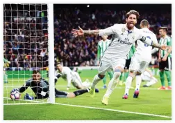  ??  ?? Real Madrid's Sergio Ramos celebrates after scoring his side's second goal against Real Betis during a Spanish La Liga soccer match at the Santiago Bernabeu stadium in Madrid on Sunday night. (AP)