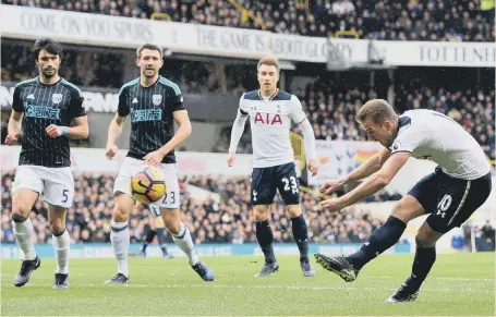  ??  ?? West Brom can only look on in horror as Harry Kane hits the first goal of his hat-trick for Tottenham on Saturday