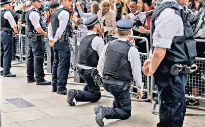  ?? ?? Knee-jerk reaction: police officers outside Downing Street during the Black Lives Matter protest in June 2020