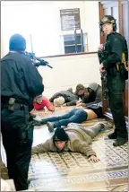  ?? The Associated Press ?? U.S. Capitol Police hold protesters at gunpoint near the House Chamber inside the U.S. Capitol on Jan. 6, in Washington.