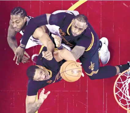  ?? AP FOTO ?? WORK HORSE. Because of the absence ofstarters Tony Parker and Pau Gasol, Kawhi Leonard (leftmost) had to put his best foot forward resulting in an overtime beating of the defending champion Cleveland Cavaliers and a new record as he scored a...