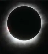  ?? Associated Press photo ?? This 2016 file photo shows a total solar eclipse in Belitung, Indonesia. A solar eclipse on Monday is set to star in several special broadcasts on TV and online. PBS, ABC, NBC, NASA Television and the Science Channel are among the outlets planning...