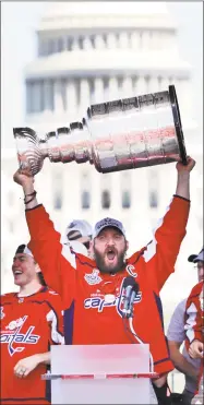  ?? Jacquelyn Martin / Associated Press ?? The Capitals’ Alex Ovechkin holds up the Stanley Cup trophy during the team’s Stanley Cup victory celebratio­n at the National Mall in Washington.