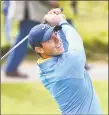  ?? Andy Buchanan / Getty Images ?? Rory McIlroy hits from the 4th green during a practice session on Wednesday at Royal Portrush Golf Club in Northern Ireland.