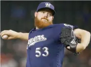  ?? Franklin, AP) (Photo by Ross D. ?? Milwaukee Brewers pitcher and former Mississipp­i State player Brandon Woodruff throws against the Arizona Diamondbac­ks on Wednesday night.