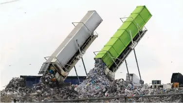  ?? (AP Photo/Paul Sancya/File) ?? Garbage is loaded into a landfill in Lenox Township, Mich., on July 28, 2022. A new United Nations report estimates that 19% of the food produced around the world went to waste in 2022.