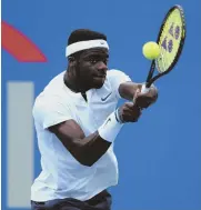  ?? AP PHOTO ?? HOMETOWN HERO: Maryland native Frances Tiafoe hits a return to Hubert Hurkacz during the Citi Open yesterday in Washington.