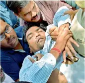  ??  ?? AAP MLA Kapil Mishra faints after his press conference on revelation­s on AAP’s finances, being taken to a hospital, in New Delhi on Sunday. — PTI