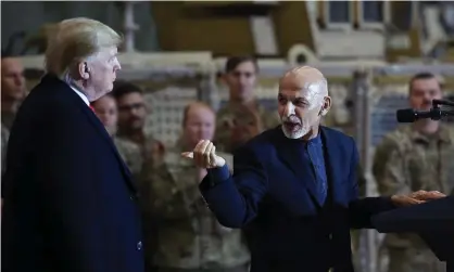  ?? Photograph: AFP /Getty ?? Ashraf Ghani, the Afghan president, addresses Donald Trump at Bagram airfield during a surprise visit on Thanksgivi­ng.