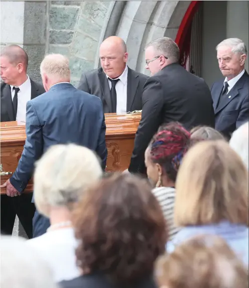  ??  ?? The coffin of Cameron Reilly is carried from St Brigid’s church. Picture: Paul Connor.