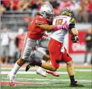  ?? JAMIE SABAU / GETTY IMAGES ?? Sophomore Chase Young wants to help the Buckeyes maintain a tradition of strong pass-rushing ends.