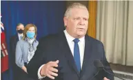  ?? FRANK GUNN / THE CANADIAN PRESS ?? Premier Doug Ford speaks at Queen's Park in Toronto on Tuesday, announcing a state of emergency and stay-at-home order for the province of Ontario.