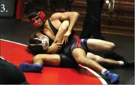  ?? Alex Eller ?? 3. Tryon Calleroz of Arcadia-Loup City pins his opponent from Wood River during the Broken Bow Triangular on Dec. 3. Calleroz won both his mathces on the night.
3.