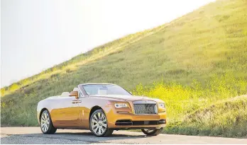  ??  ?? At 2,560 kilograms, the 2017 Rolls-Royce Dawn drophead is a land yacht with a whisper-quiet ride.