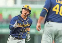  ?? KATIE STRATMAN/USA TODAY SPORTS ?? Brewers second baseman Keston Hiura runs the bases after hitting a solo home run against the Reds in the seventh inning at Great American Ball Park.