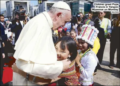  ?? REUTERS ?? Children greet Pope Francis in Yangon, Myanmar on Monday.