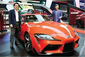  ?? AGFI SAGITTIAN/JAWA POS ?? COMING SOON: Direktur Marketing PT Toyota-Astra Motor (TAM) Anton Jimmi Suwandy (kanan) dan Kazunori Minamide saat memperkena­lkan Toyota GR Supra dalam pergelaran GIIAS 2019.