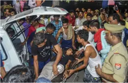  ?? — PTI ?? An NCC cadet being taken to treatment after an alleged case of food poisoning at their training camp in Allahabad on Monday.