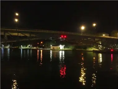  ?? RICHARD PAYERCHIN — THE MORNING JOURNAL ?? The Charles Berry Bascule Bridge sits over the Black River the night of Aug. 26 in Lorain. Local leaders said they support new aesthetic lights to illuminate the bridge at night, but installing new lights likely won’t be cheap or happen soon.