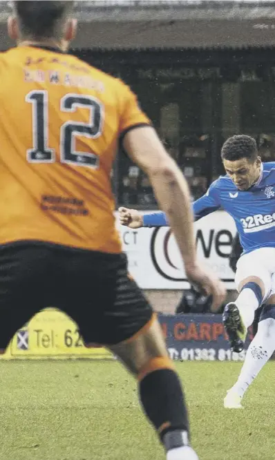  ??  ?? 0 A stunning free-kick from captain James Tavernier puts Rangers ahead after 26 minutes at Tannadice yesterday. The win put Rangers 15 points ahead before Celtic cut the deficit to 13 later in the afternoon