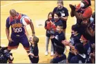  ?? Ned Gerard / Hearst Connecticu­t Media file photo ?? Ansonia school students learn basketball tricks from Dwayne “Swoop” Simpson of the Harlem Wizards basketball team prior to a re-dedication ceremony in the newly renovated Ansonia Armory gymnasium on Dec. 22.