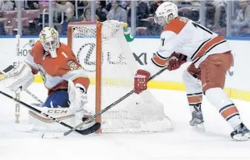  ?? LYNNE SLADKY/AP ?? Carolina’s Jordan Staal (11) attempts a shot as Florida Panthers goalie Roberto Luongo defends Tuesday night.