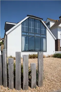  ??  ?? EXTERIOR
The once-dated chalet bungalow now makes a striking statement with modern floor-toceiling windows