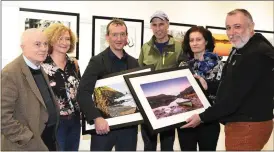  ?? Photos by Michelle Cooper Galvin ?? LEFT:Photograph­er Keith Woodard launching of the Killarney Camera Club photograph­ic Exhibition in the Killarney Library with Micheal Ó Scearoid, Mary Ann Heidtke Secretary, Terry McSweeney Chairman, Billy Horan PRO, Ille Muul on Thursday.
BELOW:...