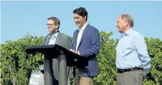  ?? ALLAN BENNER/STANDARD STAFF ?? Prime Minister Justin Trudeau, centre, with St. Catharines MP Chris Bittle, left, and Niagara College president Dan Patterson.