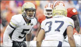  ?? TYLER SMITH / GETTY IMAGES ?? When Tech and quarterbac­k Justin Thomas had the ball, Clemson’s defensive line often shifted before the snap.