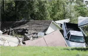  ?? Associated Press ?? ■ This March 19 photo shows damage to a home in the small neighborho­od of San Jacinto River Estates in Channelvie­w, Texas, which was flooded during Hurricane Harvey and remains damaged. The neighborho­od is just north of the waste pits Superfund site...