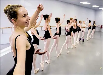  ?? Arkansas Democrat-Gazette/JOHN SYKES JR. ?? Sophia Young gives a smile as she practices her moves.