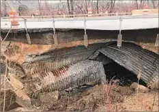  ?? Provided by Rensselaer County ?? Route 7 in Hoosick is closed after a culvert collapsed Friday. Work is under way to replace it.