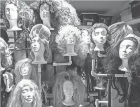  ?? ?? Walker’s wig collection rests atop a custom tree in his garage of his home in Fort Worth, Texas. He says that as a profession­al, he and other performers know to edit his drag routines when children are in the crowd.
