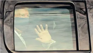  ?? YURI GRIPAS ABACA PRESS/TRIBUNE NEWS SERVICE ?? U.S. President Donald Trump waves to supporters from a motorcade outside the hospital where he is getting treatment for COVID-19 on Sunday in Bethesda, Md. “I learned a lot about COVID,” Trump said in a video posted later that day. “I learned it by really going to school.”